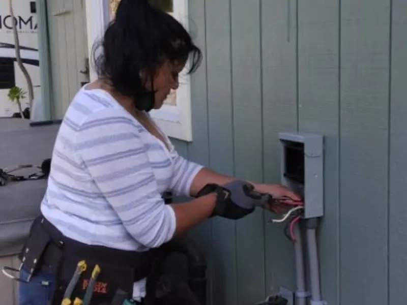 Licensed electrician wiring an exterior subpanel in Bremen